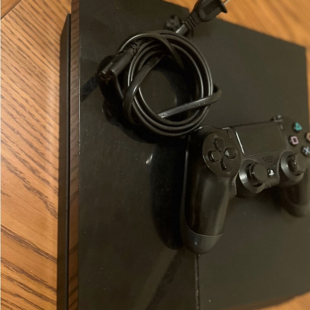 Sold cross listed PS 4 500GB Console - Black (includes two wireless controllers)